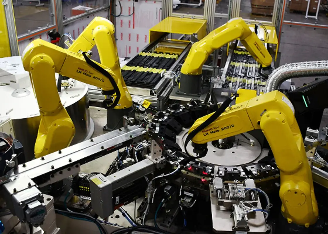 Multiple FANUC robots working within an automated assembly cell